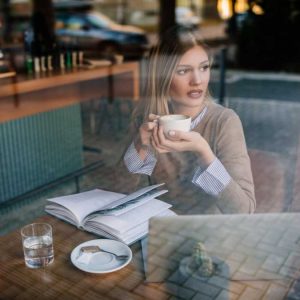 Sad Women in Coffee Shop