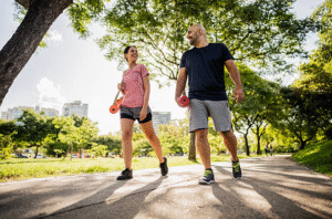 Couple walking in the park for stress management exercise in Houston