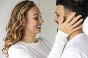 Happy couple embracing with love and joy after practicing Christ-centered forgiveness