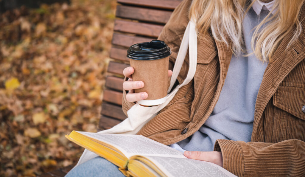 Woman reading the Bible with coffee, reflecting on Christ-centered forgiveness and faith