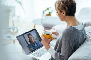 Woman attending an online Christian counseling session from home in Frisco, Texas, receiving virtual faith-based support through video call