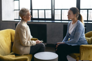Licensed therapist meeting face-to-face with a client, demonstrating the importance of human connection in therapy.