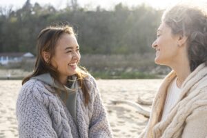 Two women in a warm conversation, representing what an emotionally safe person looks like in relationship