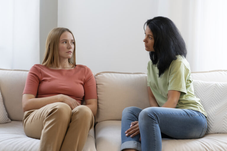 Woman sitting calmly in a conversation, representing how to stop manipulation in the moment